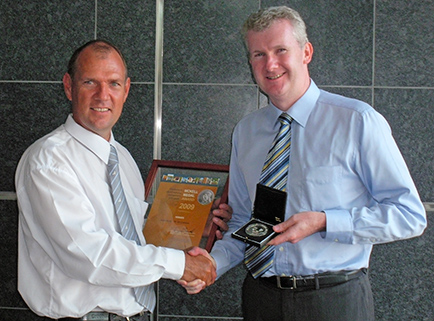 Tony Burke MP, Minister for Agriculture, Fisheries and Forestry presents Bill Crabtree with the 24th McKell Medal